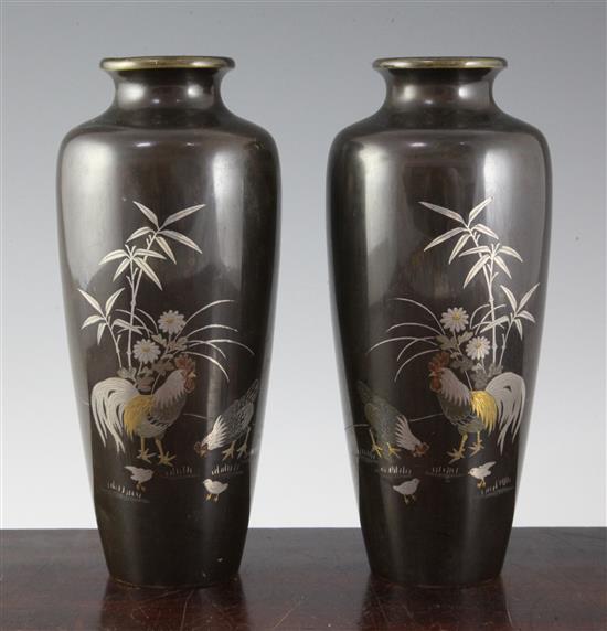 A pair of Japanese bronze, silver and gold inlaid slender vases, Meiji period, 21.5cm